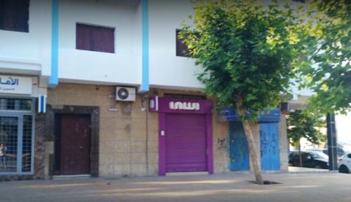 a purple door on the side of a building at One bedroom apartement at Martil 300 m away from the beach with city view and wifi in Martil