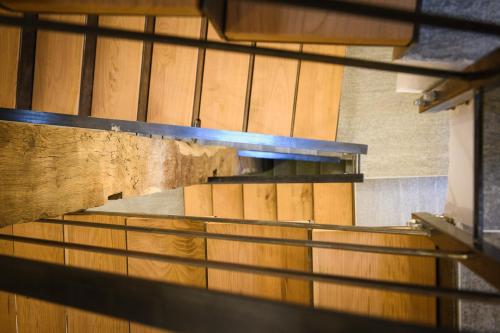 a stairway in a building with wooden walls at Agriturismo Cà Gianin in Vervio