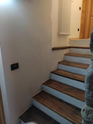 a set of stairs in a room with wooden floors at Agriturismo Cà Gianin 