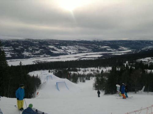 a group of people on a snow covered ski slope at Åre-Bjørnen Falken 17A in Åre