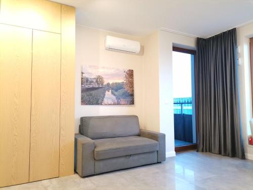 Luxusowy Apartament Klimczaka tesisinde bir oturma alanı