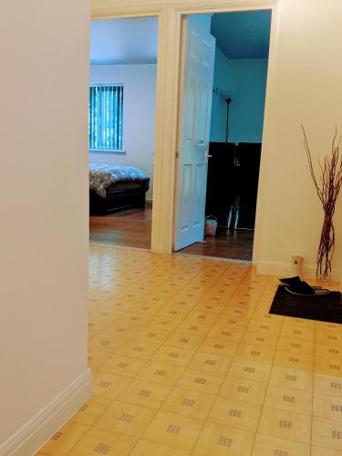 a living room with a door leading to a bedroom at Oaklawn Apartment - Sleeps 4 Parking & Garden in Woking