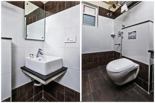 a bathroom with a white toilet and a sink at THE ELITE INN in Visakhapatnam