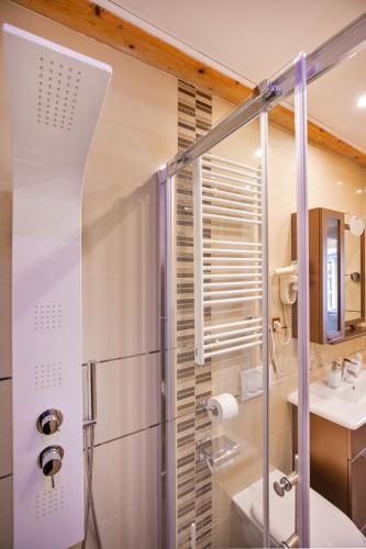 a bathroom with a shower and a sink at Apartments Espana 2 in Dubrovnik