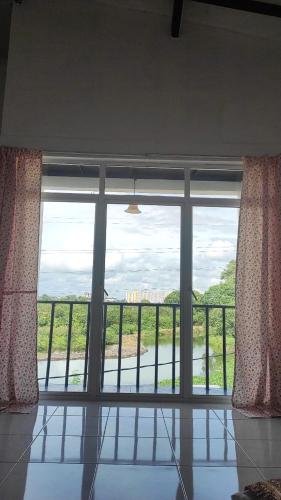 a room with a large window with a view at Chrisber Villa in Rajagiriya