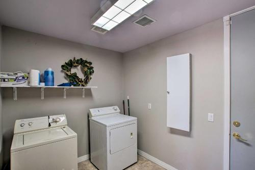 a laundry room with a washing machine and a window at Mtn-View Home with Pool in Fountain Hills in Fountain Hills