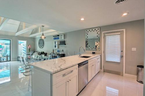 a kitchen with a sink and a counter top at Coastal Resort Beach Villa Less Than 1 Mi to Shore! in Hilton Head Island