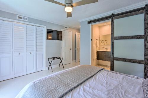 a bedroom with a bed and a ceiling fan at Coastal Resort Beach Villa Less Than 1 Mi to Shore! in Hilton Head Island