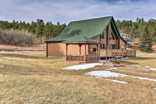 a log cabin with a gazebo in a field at Scenic Hill City Cabin Hiking and ATV Trail Access in Hill City