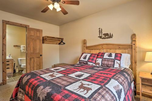 a bedroom with a bed and a ceiling fan at Scenic Hill City Cabin Hiking and ATV Trail Access in Hill City