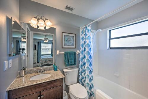 a bathroom with a toilet and a sink and a tub at Condo with Screened-in Porch, 1 Mi to Sebring Golf! in Sebring