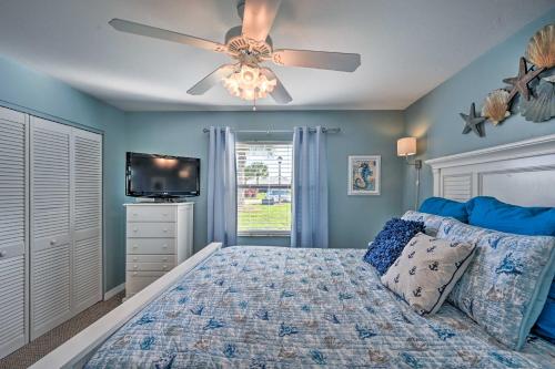 a bedroom with a bed and a ceiling fan at Condo with Screened-in Porch, 1 Mi to Sebring Golf! in Sebring