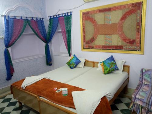 Кровать или кровати в номере Ratan Hostel
