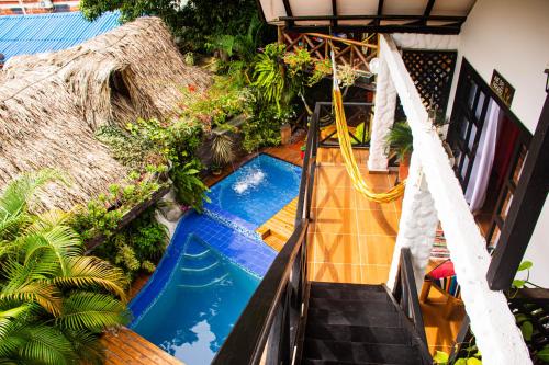 an overhead view of a swimming pool in a house at Hostal Antawara Tayrona in El Zaino