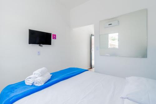 Blue Ocean Suites - Aeroporto Congonhas tesisinde bir odada yatak veya yataklar