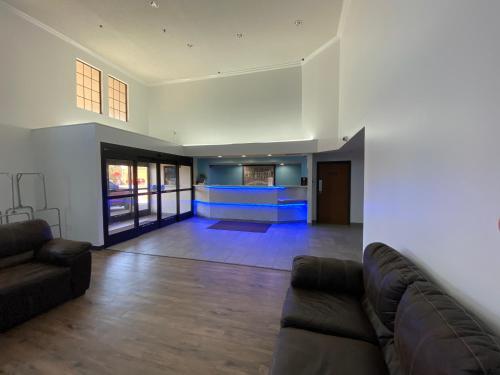 a living room with a couch and a fireplace at Hometown Place in Olive Branch