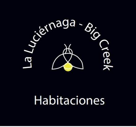 a logo for a multinational company with an umbrella at La Luciernaga Big Creek in Bocas del Toro