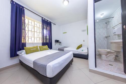 Un pat sau paturi într-o cameră la Ayenda 1231 Paradise Center