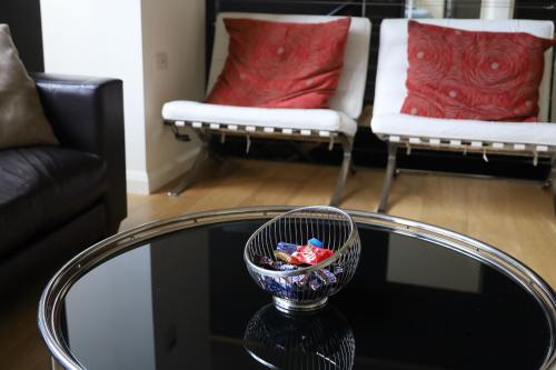 a glass table with a bowl on top of a table at The Walkup Southbank in Melbourne