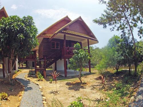 a house in the middle of a forest at Chaipura Resort in Ko Chang