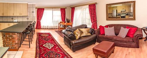 Posezení v ubytování Antiqua Cottage