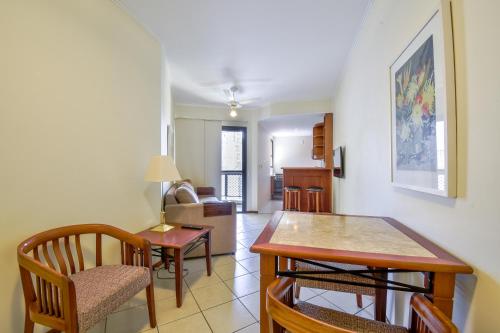 a kitchen and living room with a table and chairs at Park Tower Campinas Residence by Nacional Inn in Campinas