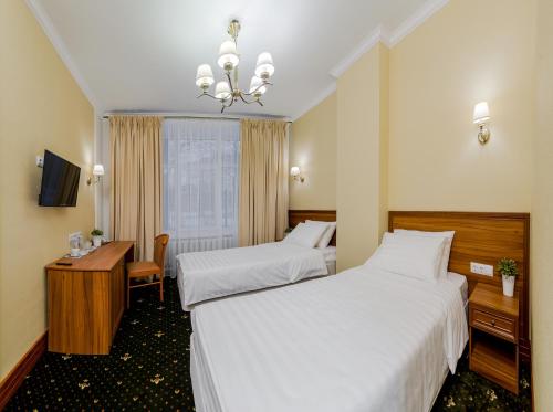 Кровать или кровати в номере Отель МашБах