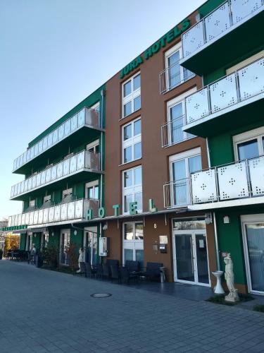 a building with balconies on the side of it at Jura Hotel in Nürnberg