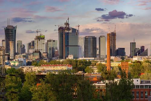 a view of a city skyline with tall buildings at Business Center Apartments Warsaw Wola by Renters in Warsaw