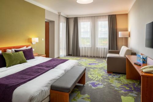Postel nebo postele na pokoji v ubytování Hotel Karos Spa