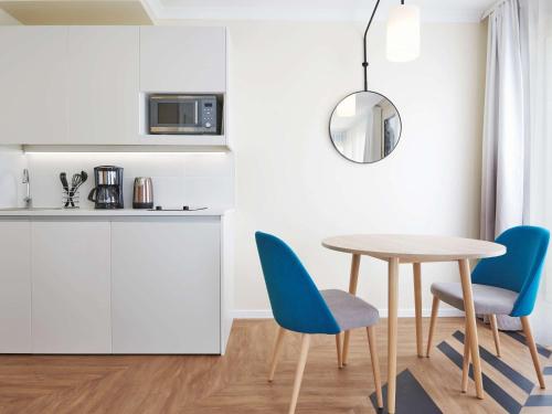 Kuchyň nebo kuchyňský kout v ubytování Aparthotel Adagio Porte de Versailles