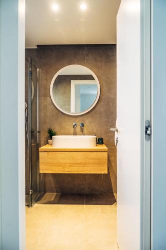 a bathroom with a sink and a mirror at Villa Jadran in Promajna