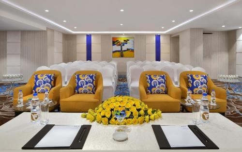 a room with a table and chairs in a room at Fortune Inn Promenade, Vadodara - Member ITC Hotels' Group in Vadodara