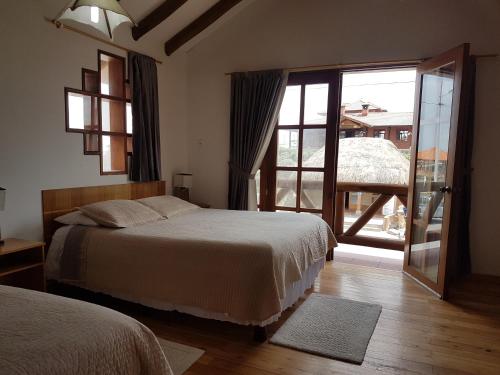 En eller flere senge i et værelse på Hotel PrincesaToa