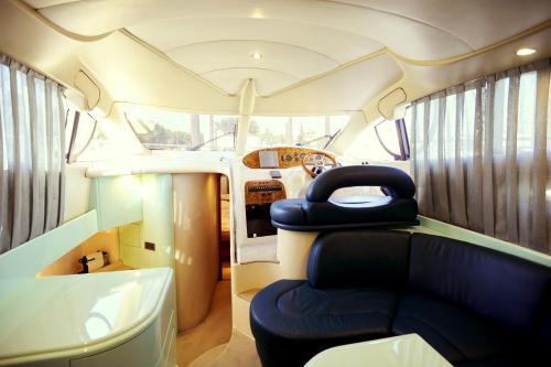 a bus with blue seats in the back of it at Cozy room with lake view in Porto 12 m² and terrace in Porto