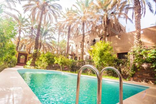 The swimming pool at or close to 7 bedrooms house with shared pool terrace and wifi at Zagora
