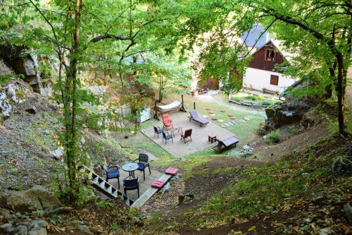an overhead view of a patio with tables and chairs at 2 bedrooms chalet with jacuzzi furnished garden and wifi at Gospic in Gospić