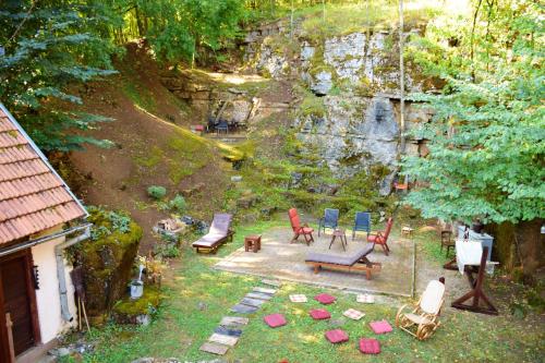 an aerial view of a backyard with chairs and a swing at Cosy Chalet in Gospić with Jacuzzi and Mountain View in Gospić