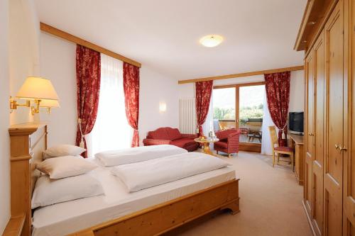 Postel nebo postele na pokoji v ubytování Hotel Garni Partaneshof