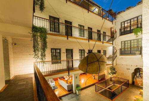 an overhead view of a building with a hanging basket at Palla Boutique Hotel in Arequipa