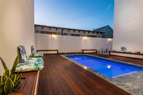 a swimming pool in the middle of a house at Oceanway Boutique Hotel/Conference in Cape Town