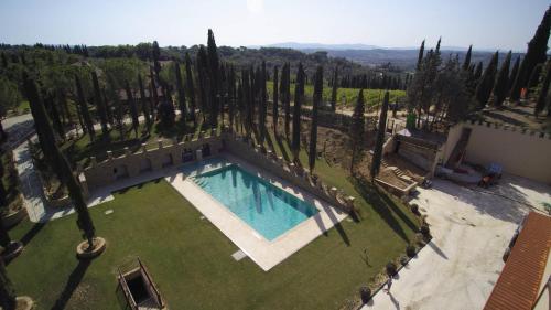 an aerial view of a swimming pool in a yard with trees at Tenuta Tegolato in Barberino di Val dʼElsa