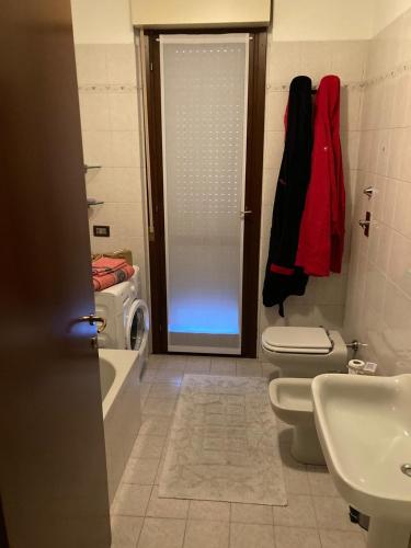 a bathroom with a shower and a toilet and a sink at la nostra casa... in Novara