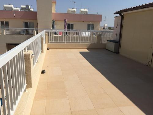 a balcony of a building with a white railing at Beautiful spacious 2-Bed Apartment in Xylofagou in Xylophaghou