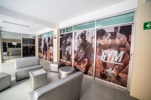 a lobby with a bunch of movie posters on the wall at Hotel Mirage in La Piedad Cavadas
