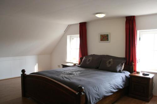 Ein Bett oder Betten in einem Zimmer der Unterkunft Logies "De Klaproos"