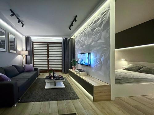 מיטה או מיטות בחדר ב-4UApart-Apartment suite Platan Grey