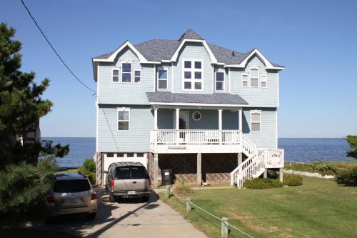 a large house with cars parked in front of it at Devon's Landing #3-PA in Avon