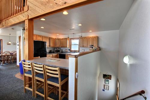 a kitchen and dining room with a table and chairs at Fishin' Friendzy #41-B in Buxton