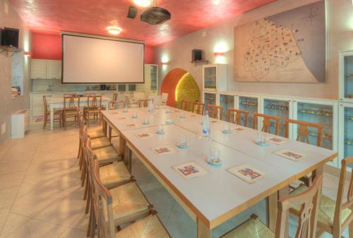 a large conference room with a large table and chairs at Raffaello Residence in Sassoferrato